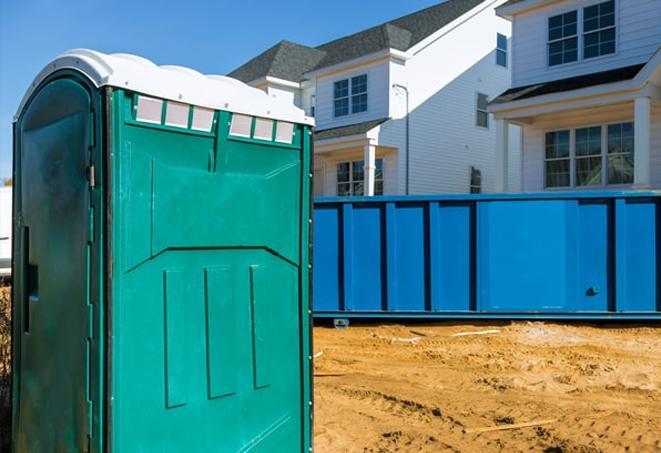 practical and convenient portable toilets at a bustling construction site